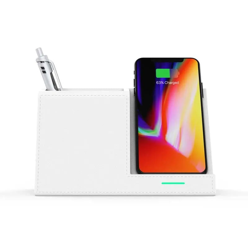 Black leather wireless charging station with built-in pen holder on a wooden desk.