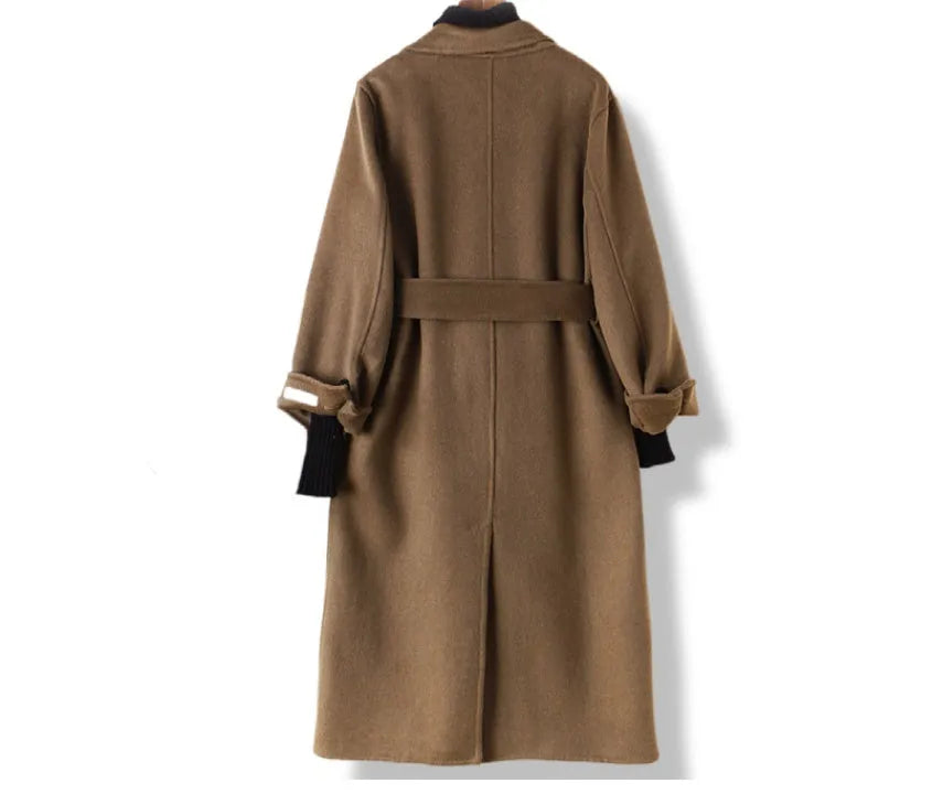 Men's long black wool coat with a suit collar laid flat.