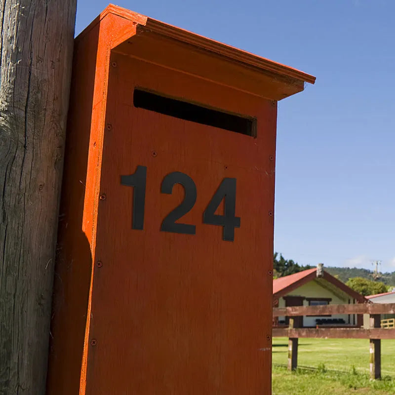 Black stainless steel adhesive house number sign showing the number 7, measuring 7.5cm.