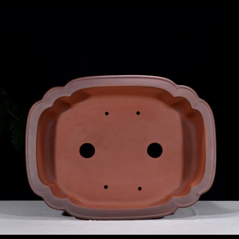 Large oval antique-finish purple clay flowerpot with carved crabapple tree design.