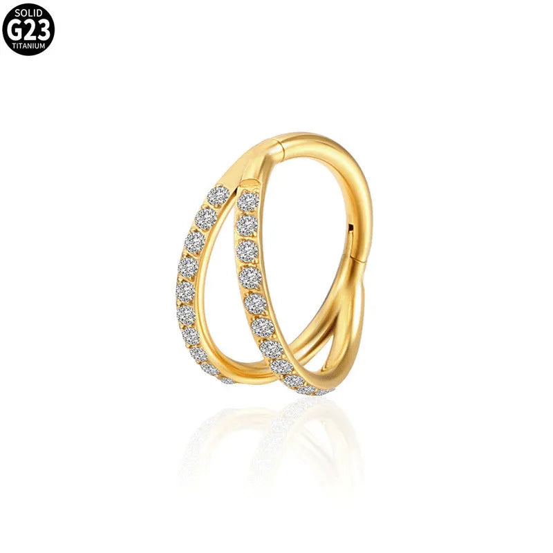 G23 titanium alloy lip and nose ring with diamond-like zircon treatment in gold or steel colour on a white background.