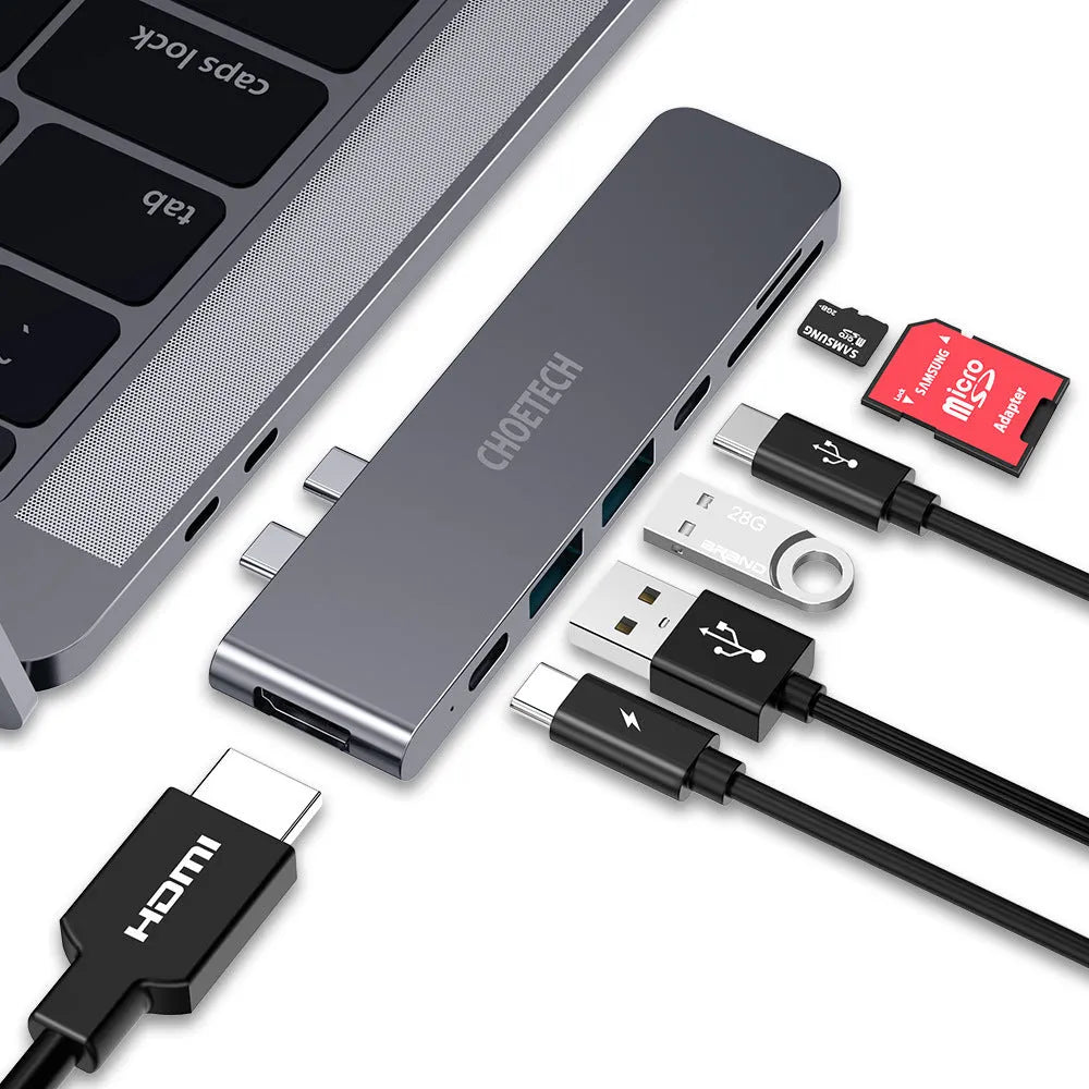 USB-C multiport adapter with Thunderbolt 3, HDMI, SD card slots, and USB ports in aluminium alloy case