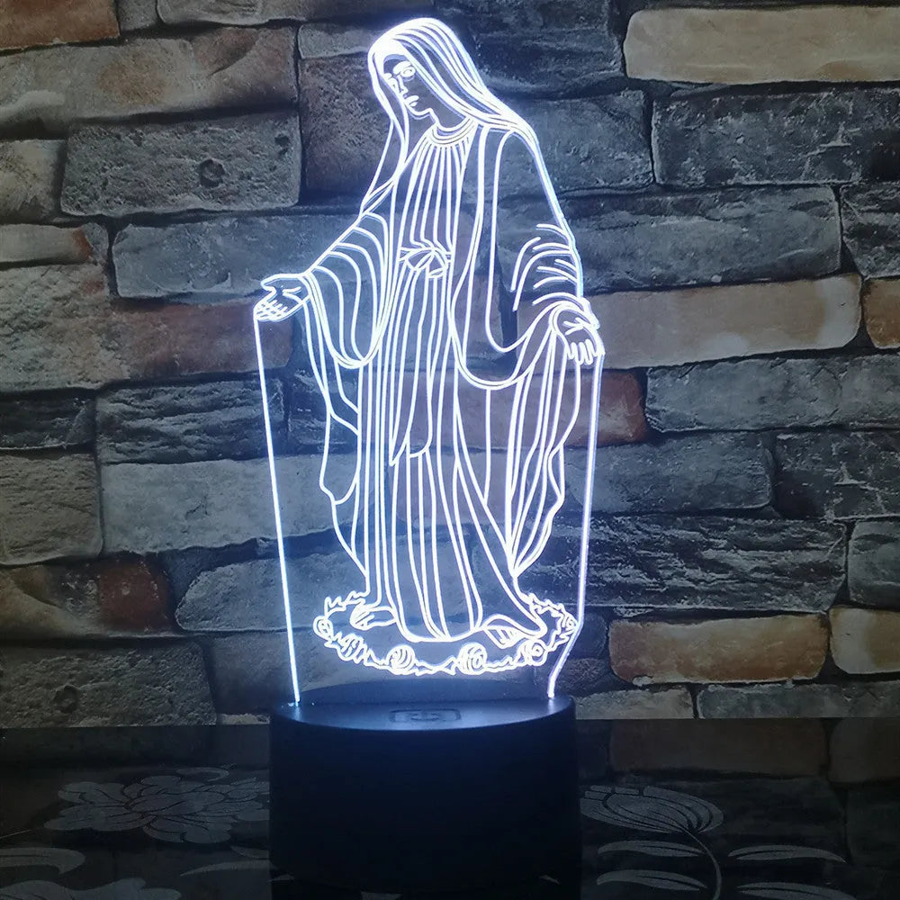 3D LED night light showing colourful dual ring pattern on acrylic panel, with remote control on desk.