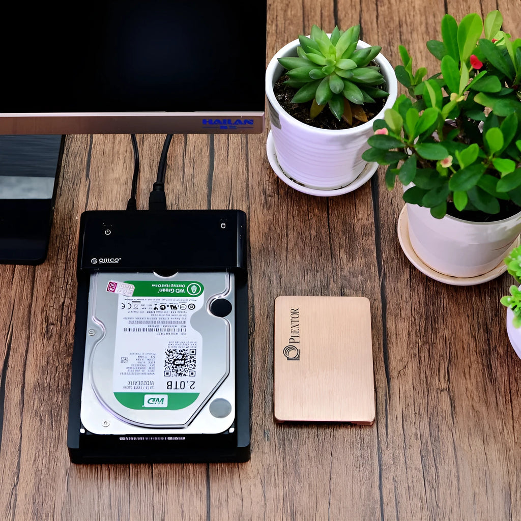Black plastic 2.5 inch SATA hard disk enclosure with USB cable for portable external storage