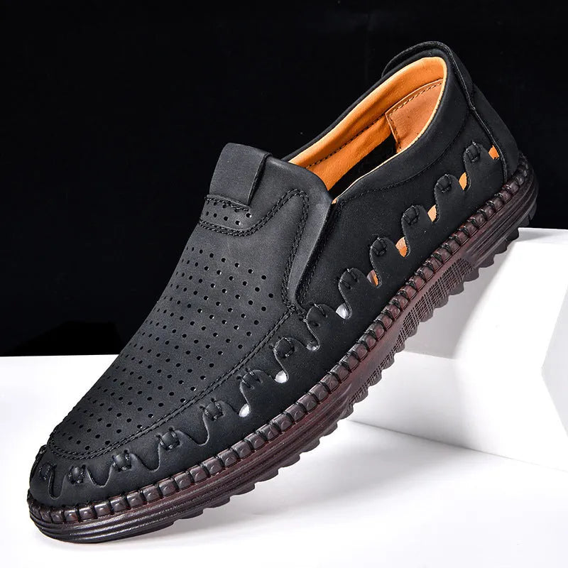 Men's brown leather slip-on casual shoes with flat sole, round toe, and decorative stitching.