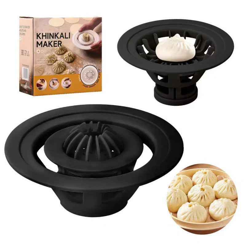 Black handheld steamed bun and dumpling mould for shaping Asian pastries.