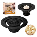 Black handheld steamed bun and dumpling mould for shaping Asian pastries.