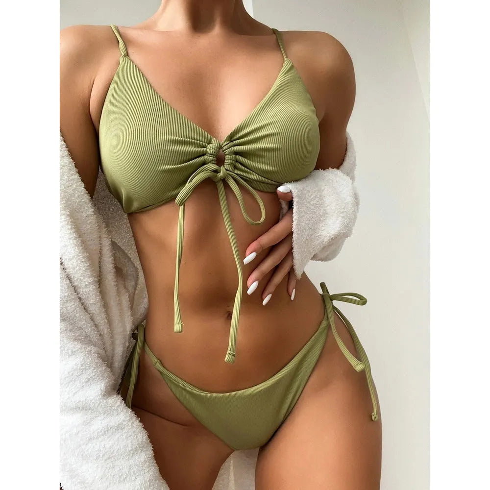 Women's solid colour drawstring bikini set on a mannequin, showing bra and briefs style.