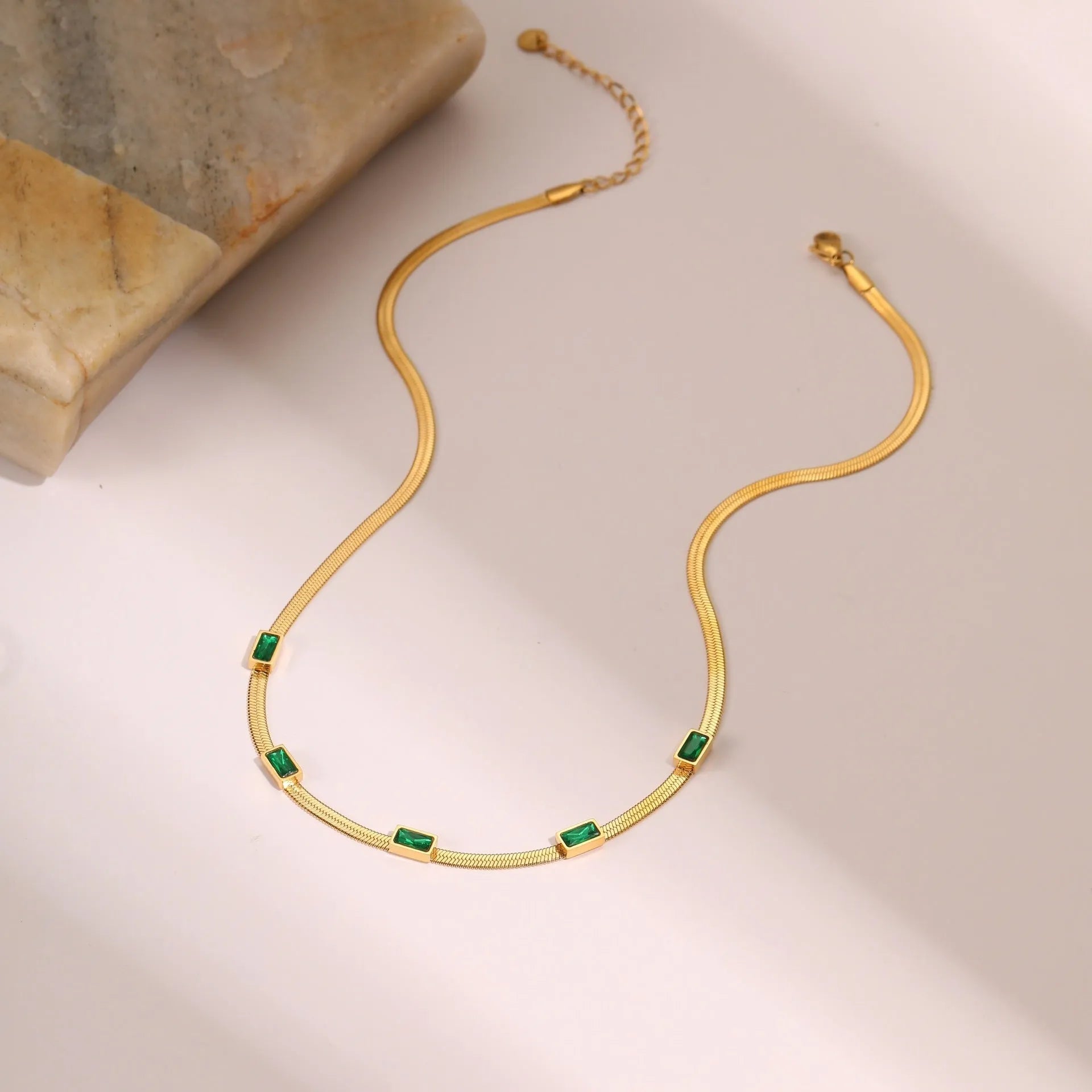 Stainless steel geometric square zircon necklace on a flat snake chain in gold or steel colour.