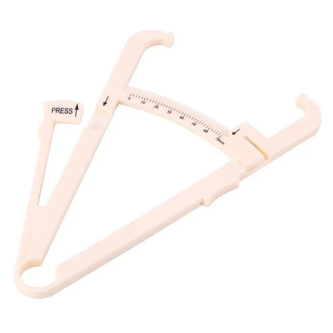 White acrylic body fat caliper skin fold thickness measuring tool on grey background.