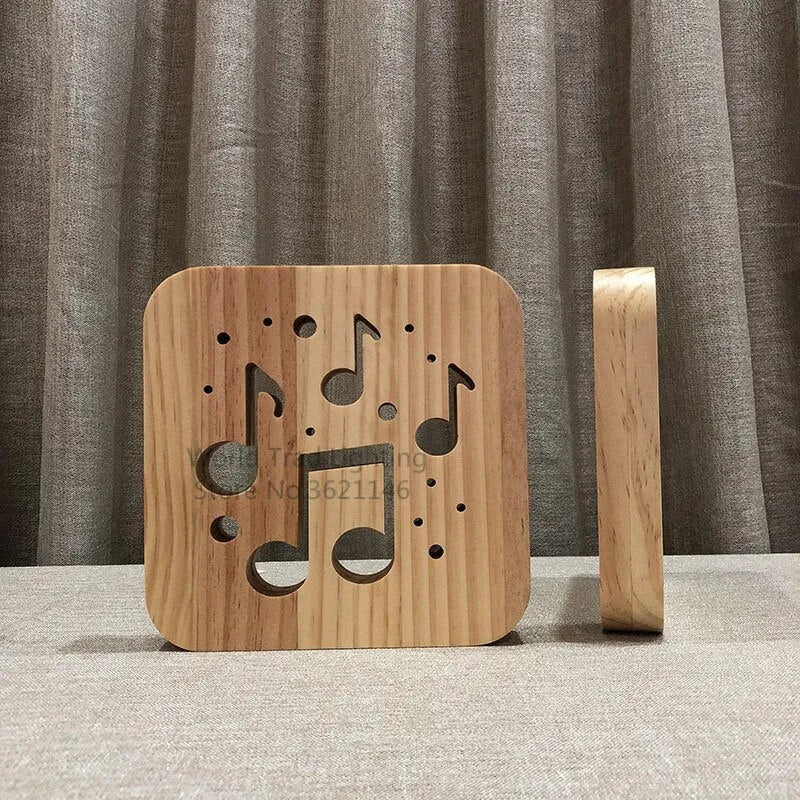 Pine wood cube LED lamp with warm white light, showing USB cable connection