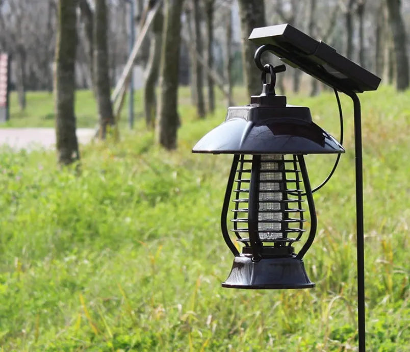 White solar-powered mosquito lamp with purple switch and LED lights for garden insect control