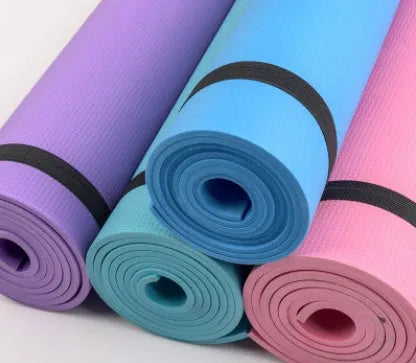 Red EVA fitness yoga mat with 6mm thickness on a wooden floor.