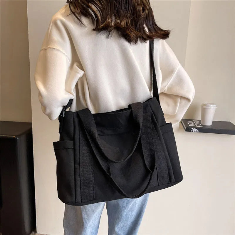 Women's large canvas shoulder tote bag with sandwich pockets and phone compartment in solid colour