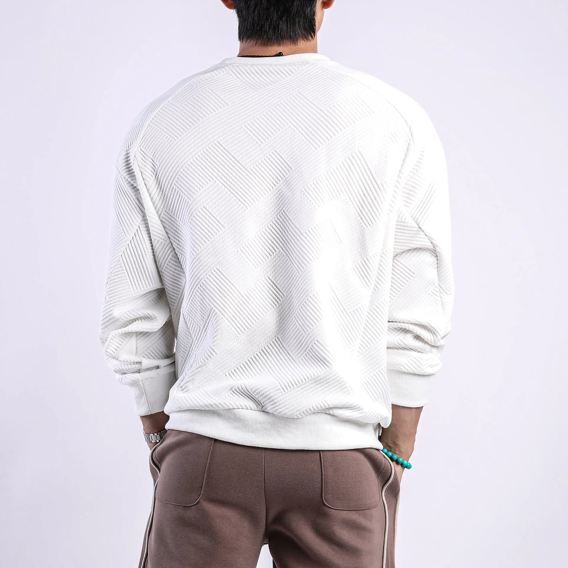 Men's loose long-sleeved sweater in twill jacquard fabric, shown in Army Green colour with a round neck.