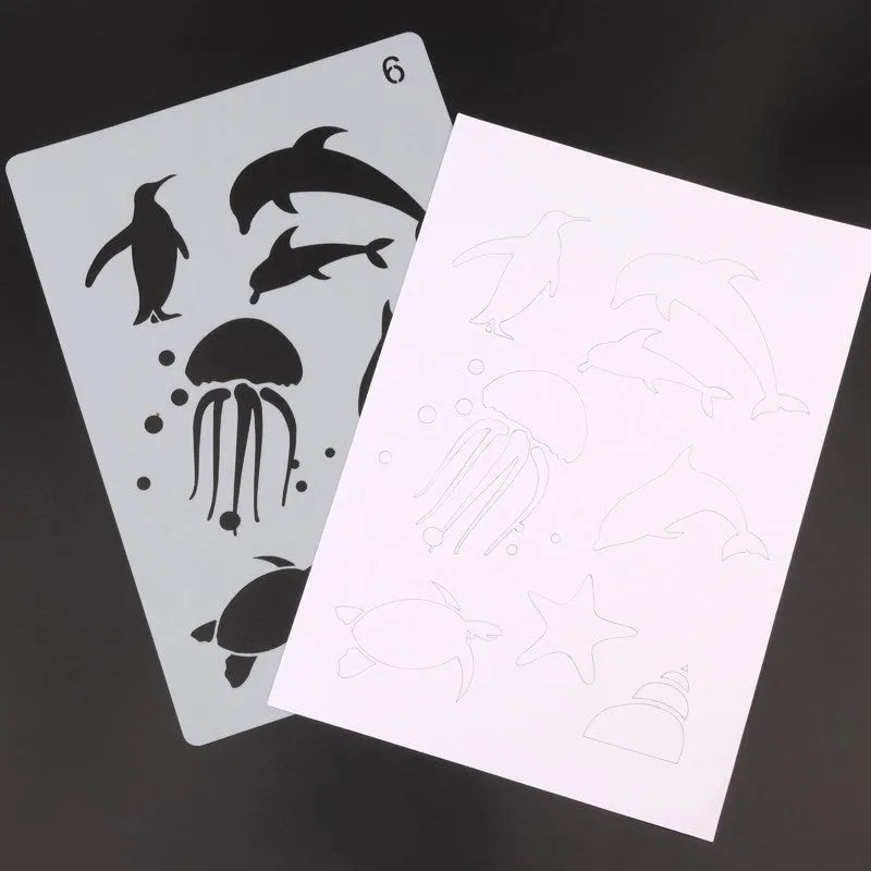 White plastic drawing stencil template for decorative patterns on a craft table.