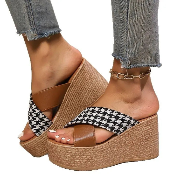 Brown and black cross leopard plaid pattern on casual wedge sandals with a rubber sole.