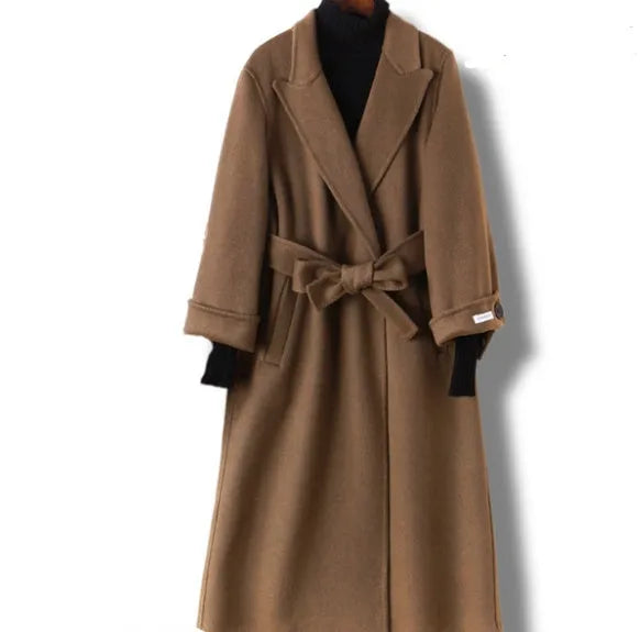 Men's long black wool coat with a suit collar laid flat.