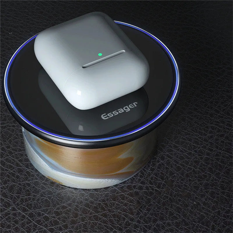 Black or white aluminium alloy wireless charging pad with LED status light on desk.