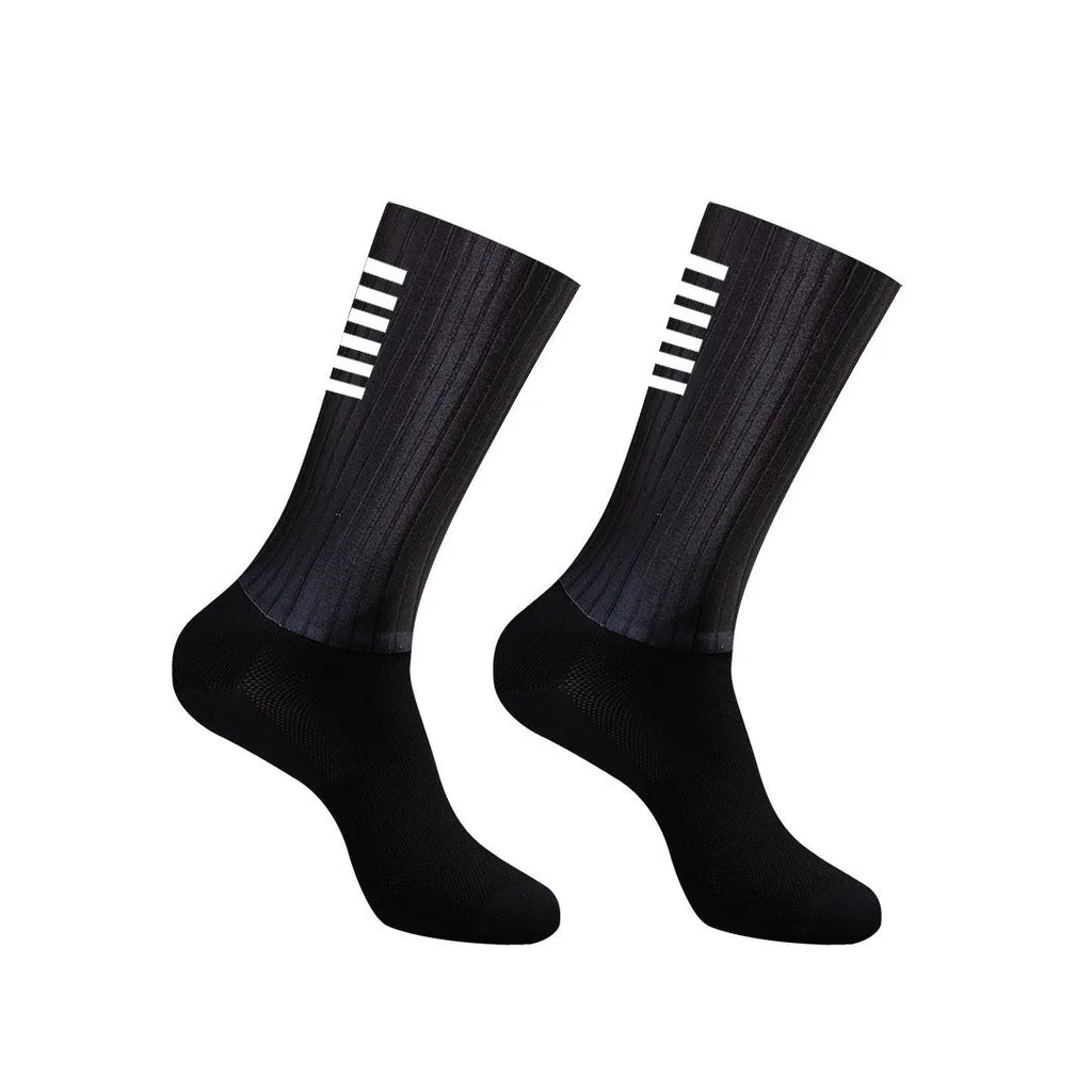 Athletic cycling and running socks in chemical fibre blend fabric, shown in orange, black, purple, white, grey or dark blue.