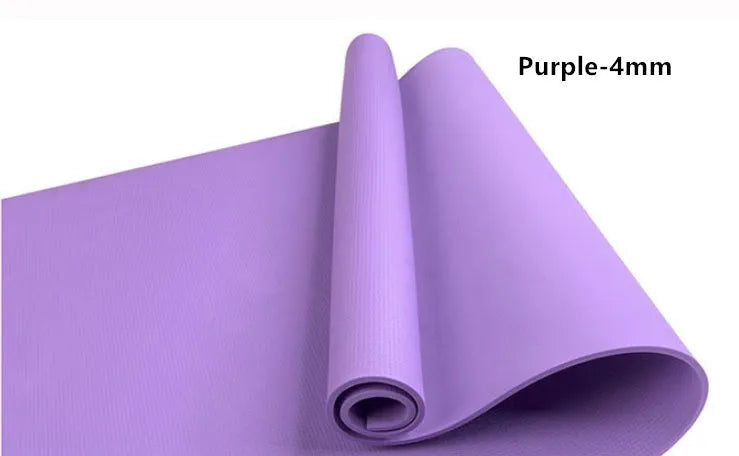 Red EVA fitness yoga mat with 6mm thickness on a wooden floor.