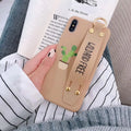 Green wristband holder phone case for iPhone showing integrated finger loop and protective back cover design