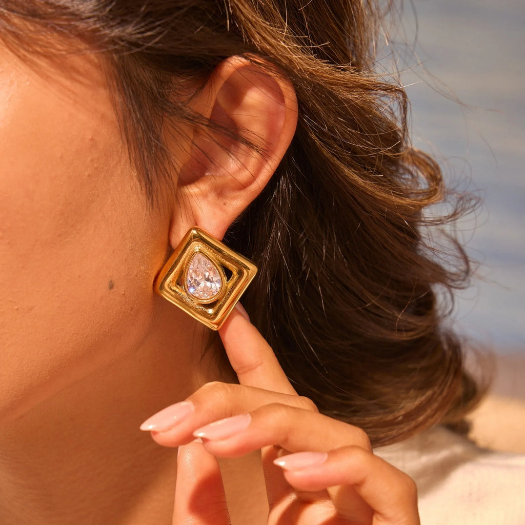 Gold electroplated stainless steel stud earrings with geometric water drop zircon inlay