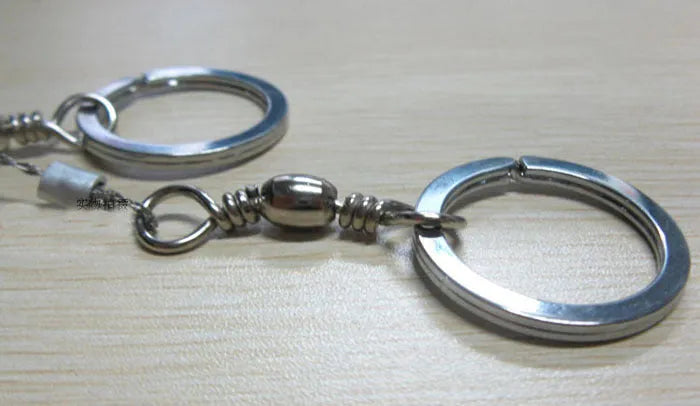 Stainless steel survival wire saw with thumb rings measuring 55cm cutting length