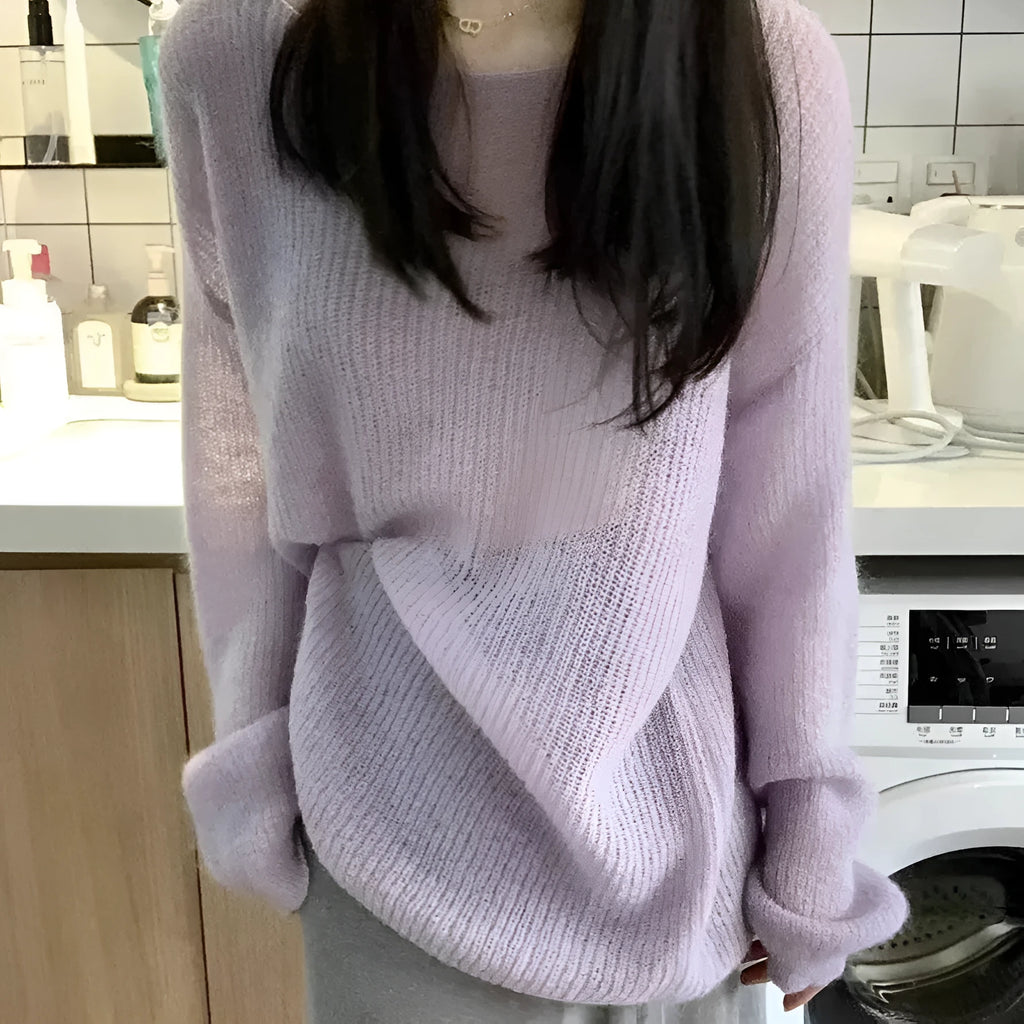 Purple women's blouse with hollow out pattern, princess sleeves, and shoulder strap detail on hanger