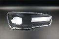 Transparent plastic headlight housing cover for vehicle lamp replacement measuring 50x30x20mm