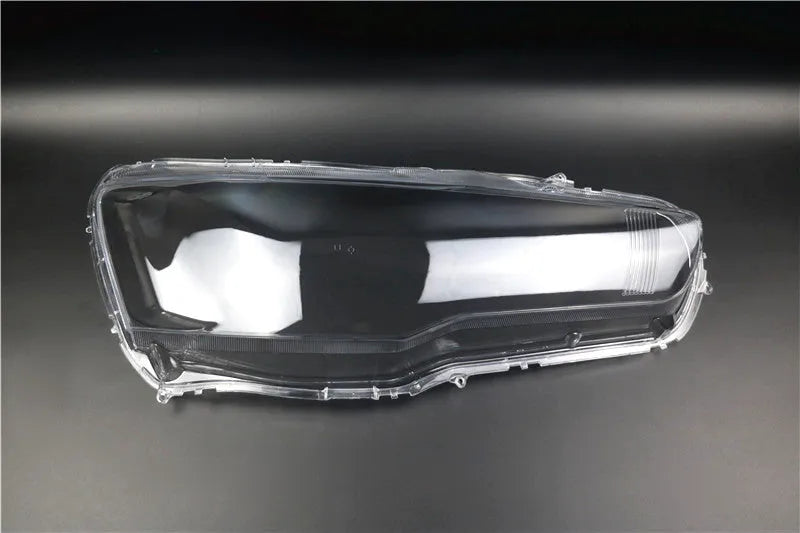 Transparent plastic headlight housing cover for vehicle lamp replacement measuring 50x30x20mm