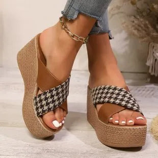 Brown and black cross leopard plaid pattern on casual wedge sandals with a rubber sole.