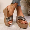 Brown and black cross leopard plaid pattern on casual wedge sandals with a rubber sole.