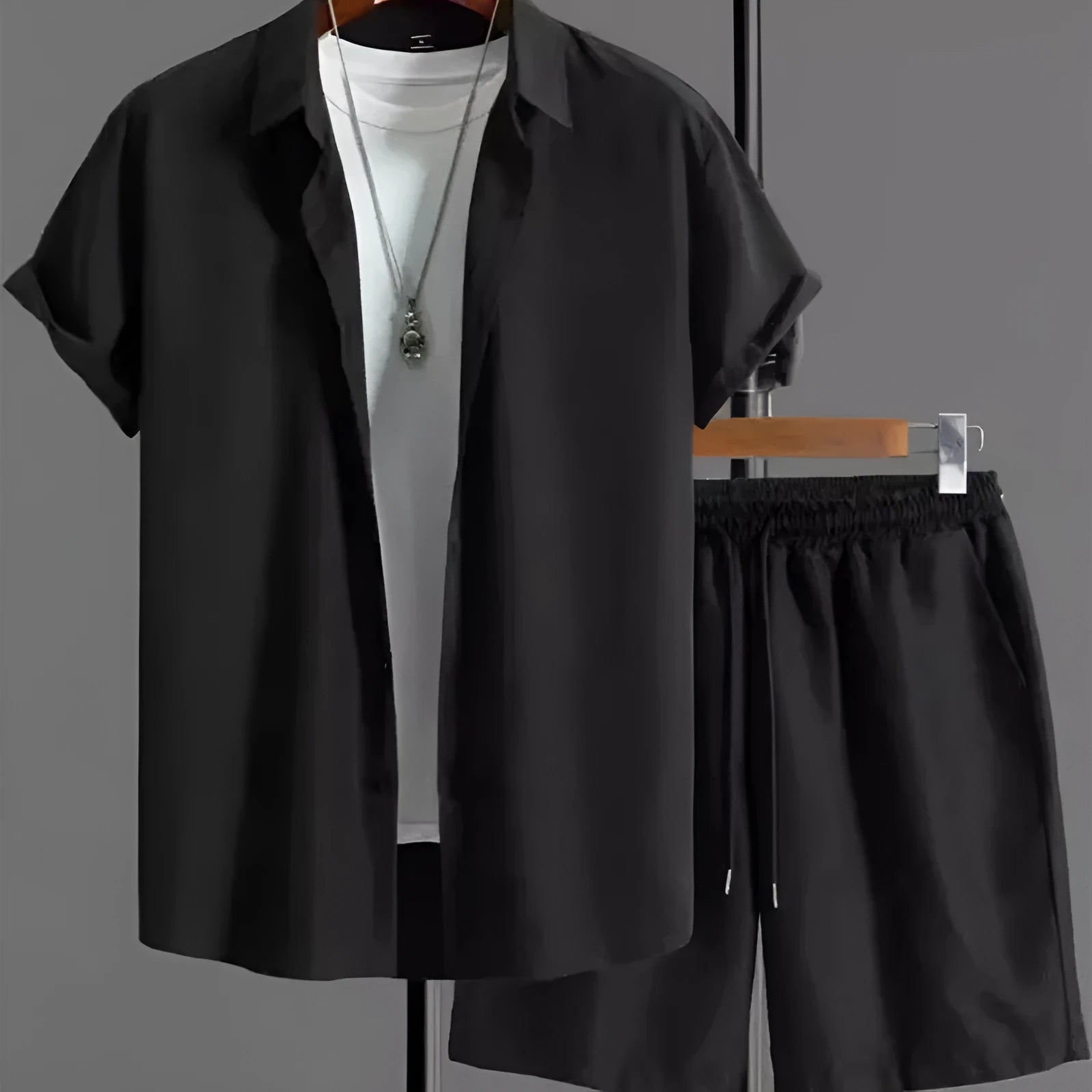 Mens black and white jacquard short sleeve shirt and matching shorts suit set on a hanger.