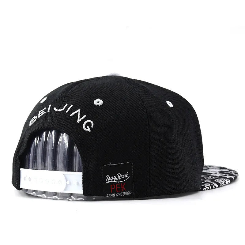 Cotton baseball cap with embroidered letters in black colour showing dome crown shape
