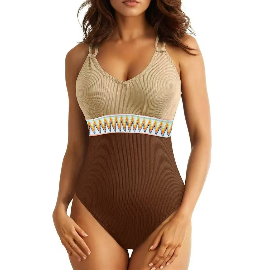 Women's one-piece swimsuit in solid colour with rib fabric and panel stitching, available in blue, brown, black and green.