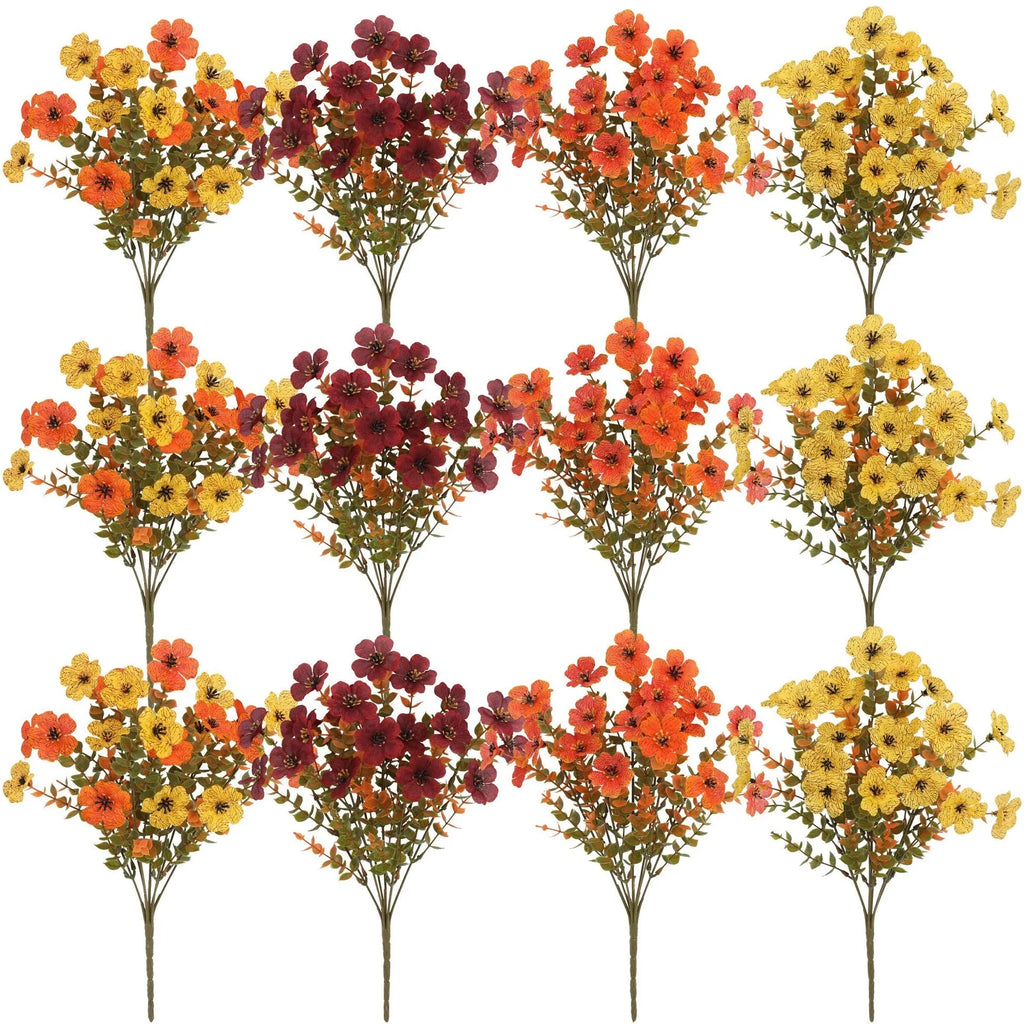 Artificial flower bouquet in autumn colours of red, yellow, orange, and orange yellow for home decoration