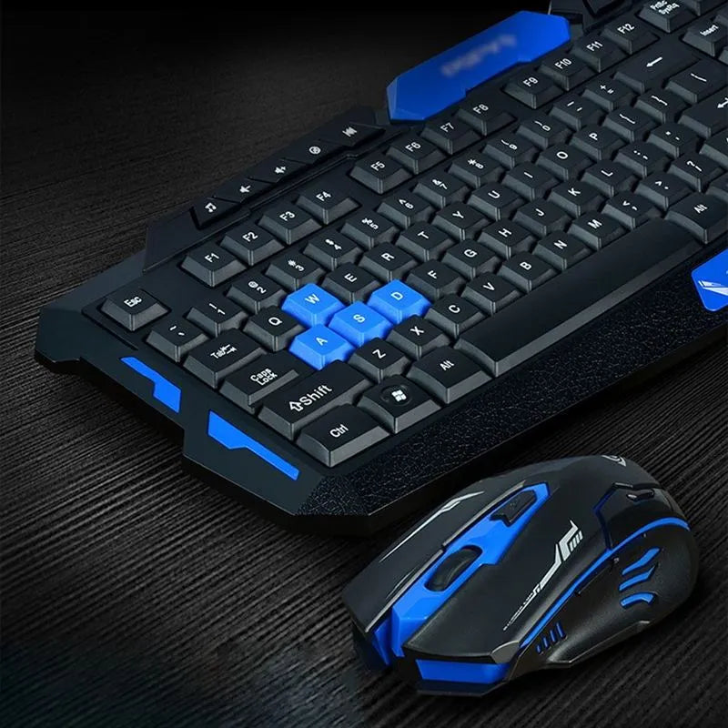 Blue and black wireless keyboard and mouse set on a desk with USB receiver.