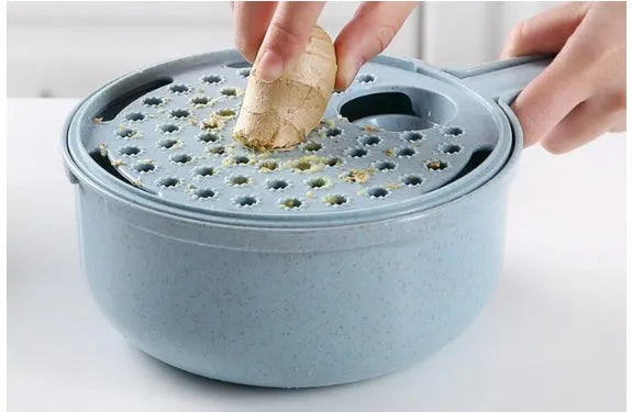 8-in-1 mandoline slicer with stainless steel blades, strainer, container, and hand protector in blue or pink.