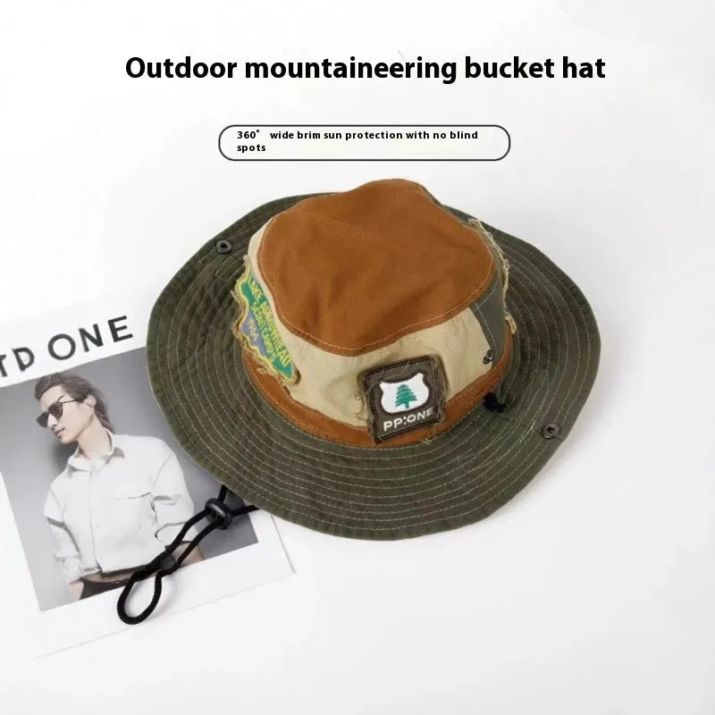 Army green cotton foldable fisherman hat with flat top crown and retro patchwork details.