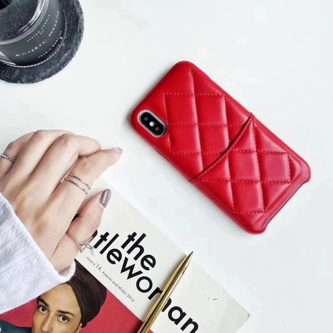 Black leather mobile phone case for iPhone XS Max on a table