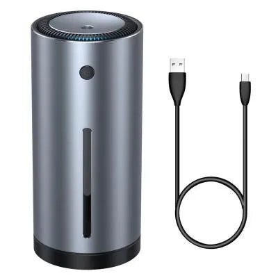 Black aluminium USB car humidifier and essential oil diffuser on a car dashboard.
