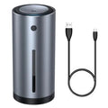 Black aluminium USB car humidifier and essential oil diffuser on a car dashboard.