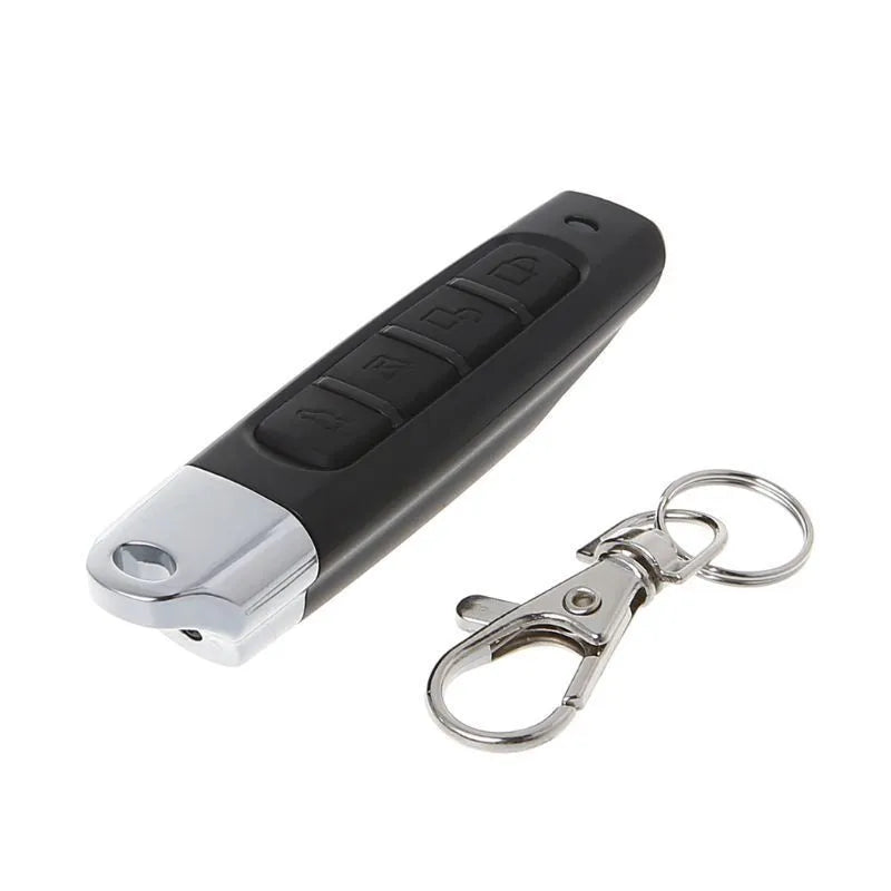 Compact black programmable remote control for rolling doors with copy button, shown next to a 12V battery.