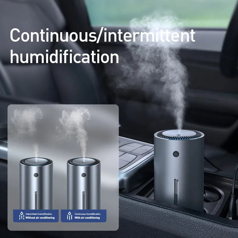 Black aluminium USB car humidifier and essential oil diffuser on a car dashboard.