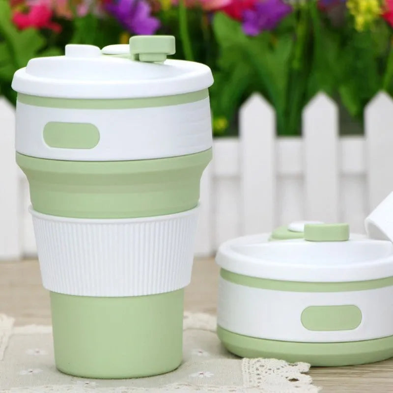 Green collapsible silicone travel cup shown folded and expanded with leak-proof cover