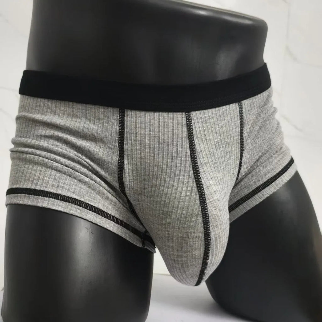 Men's solid colour boxer shorts in breathable fabric on a size chart showing L, XL, 2XL, and 3XL.