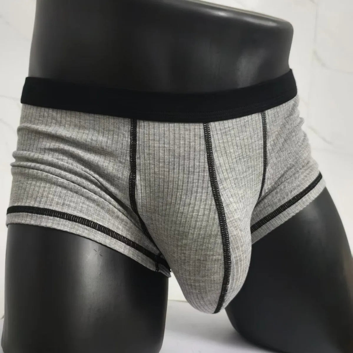 Men's solid colour boxer shorts in breathable fabric on a size chart showing L, XL, 2XL, and 3XL.