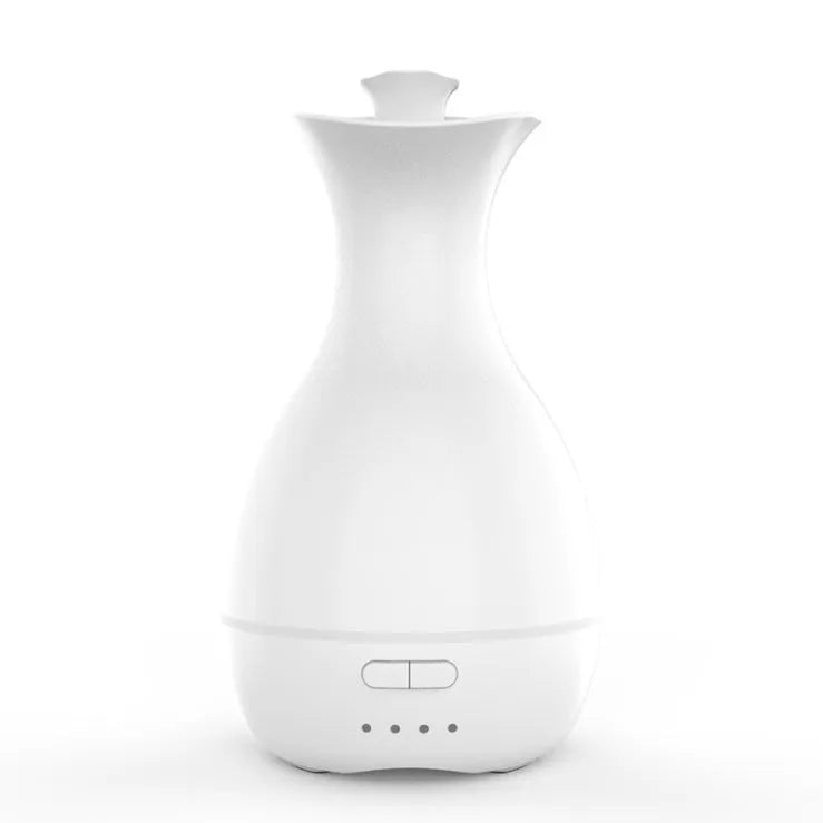 White or pink ultrasonic humidifier and essential oil diffuser vase with colourful LED night light.