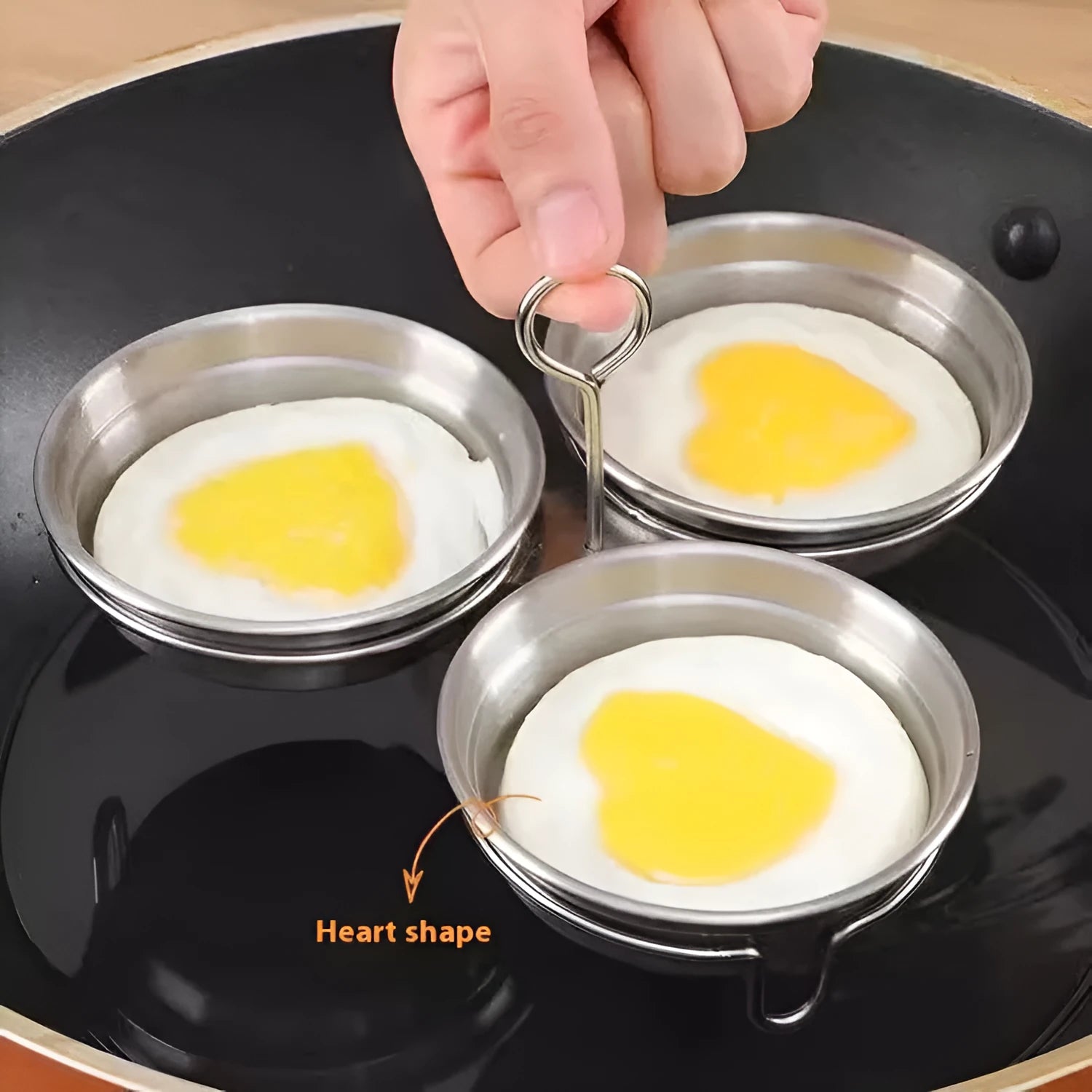 Mini stainless steel heart-shaped and round egg steamer cooker for single eggs.